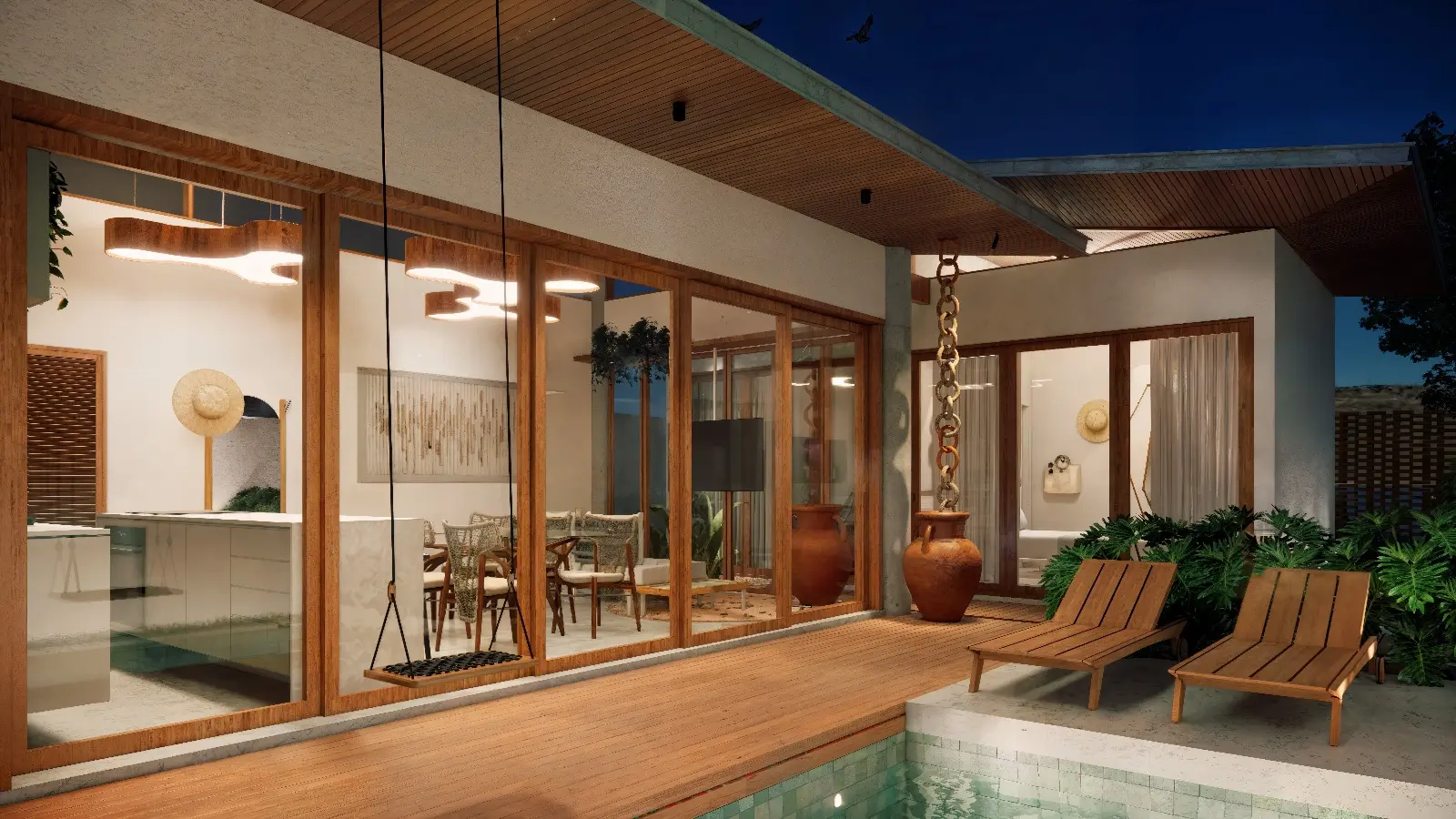 Sala e cozinha integradas, acesas ao anoitecer, abrindo para o deck de madeira e a piscina — render de uma das casas do condomínio